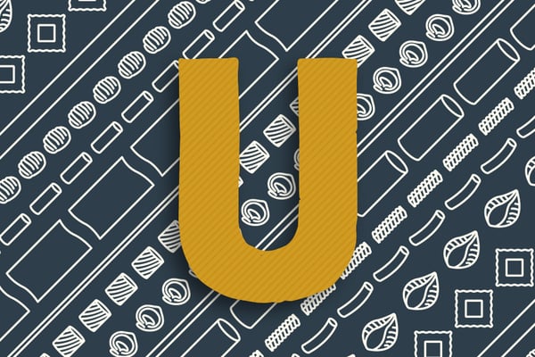 Buchstabe U in gelb auf dunklem Hintergrund